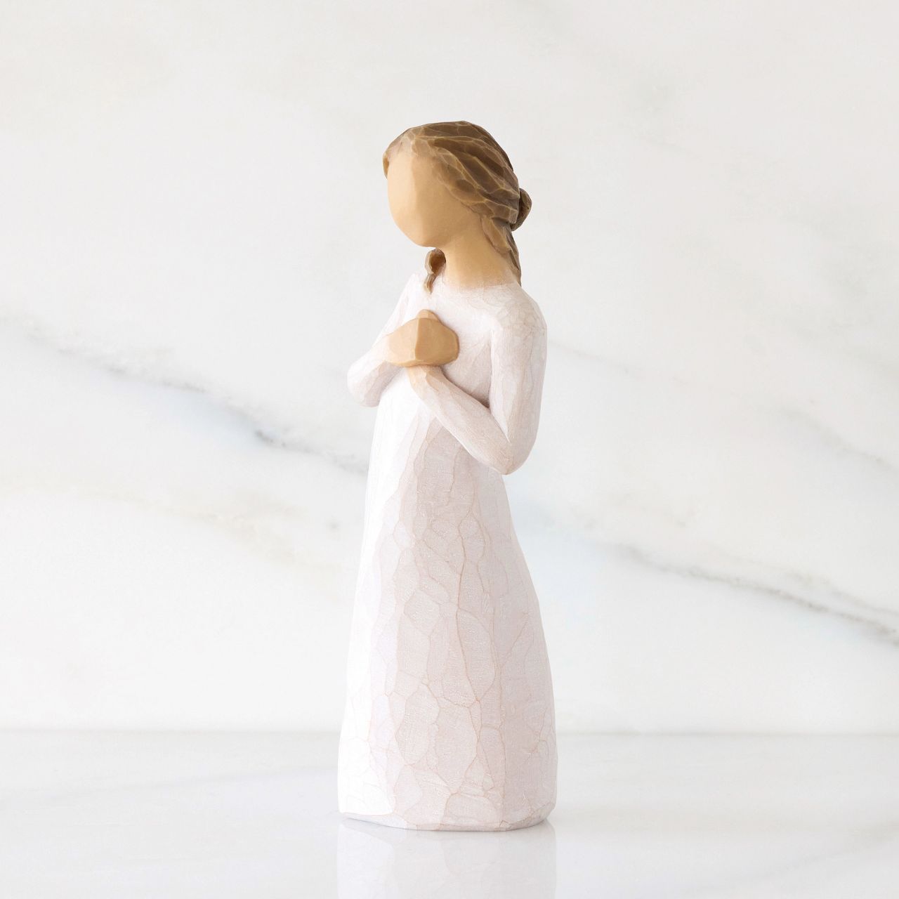 A tangible symbol of connection and support representing empathy towards someone experiencing loss or hardship; a reminder of those who are thinking of you and wishing the best for you.