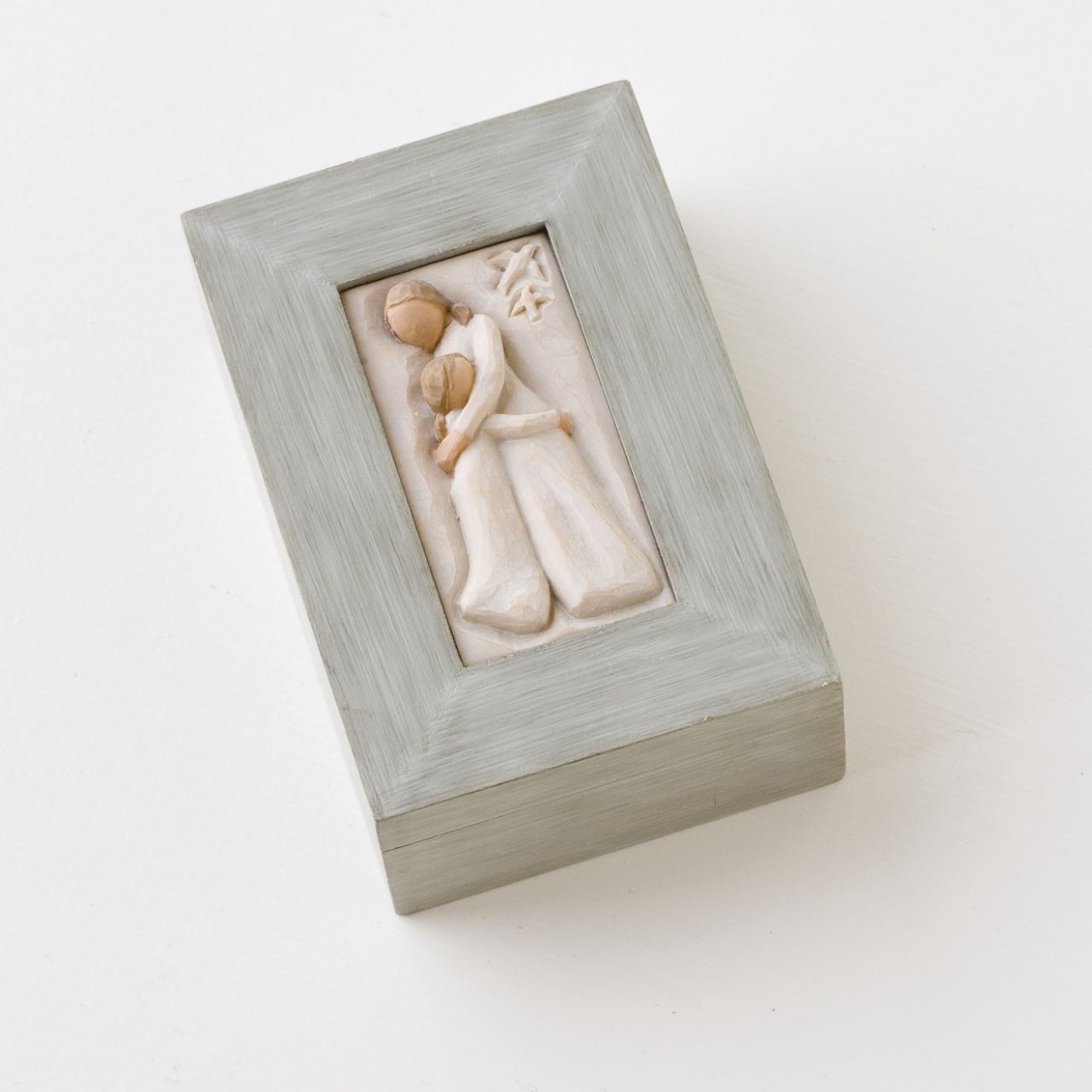 Mother and Daughter Memory Box by Willow Tree  Willow Tree is an intimate line of figurative sculpture that speaks in quiet ways to heal, comfort, protect and inspire. Artist Susan Lordi hand carves each original Willow Tree sculpture. This piece is cast from her original carving, and then painted by hand. The box features a woman holding a child. Finely crafted wood box with hinged lid is nice for notes, keys, watches, change and jewellery.