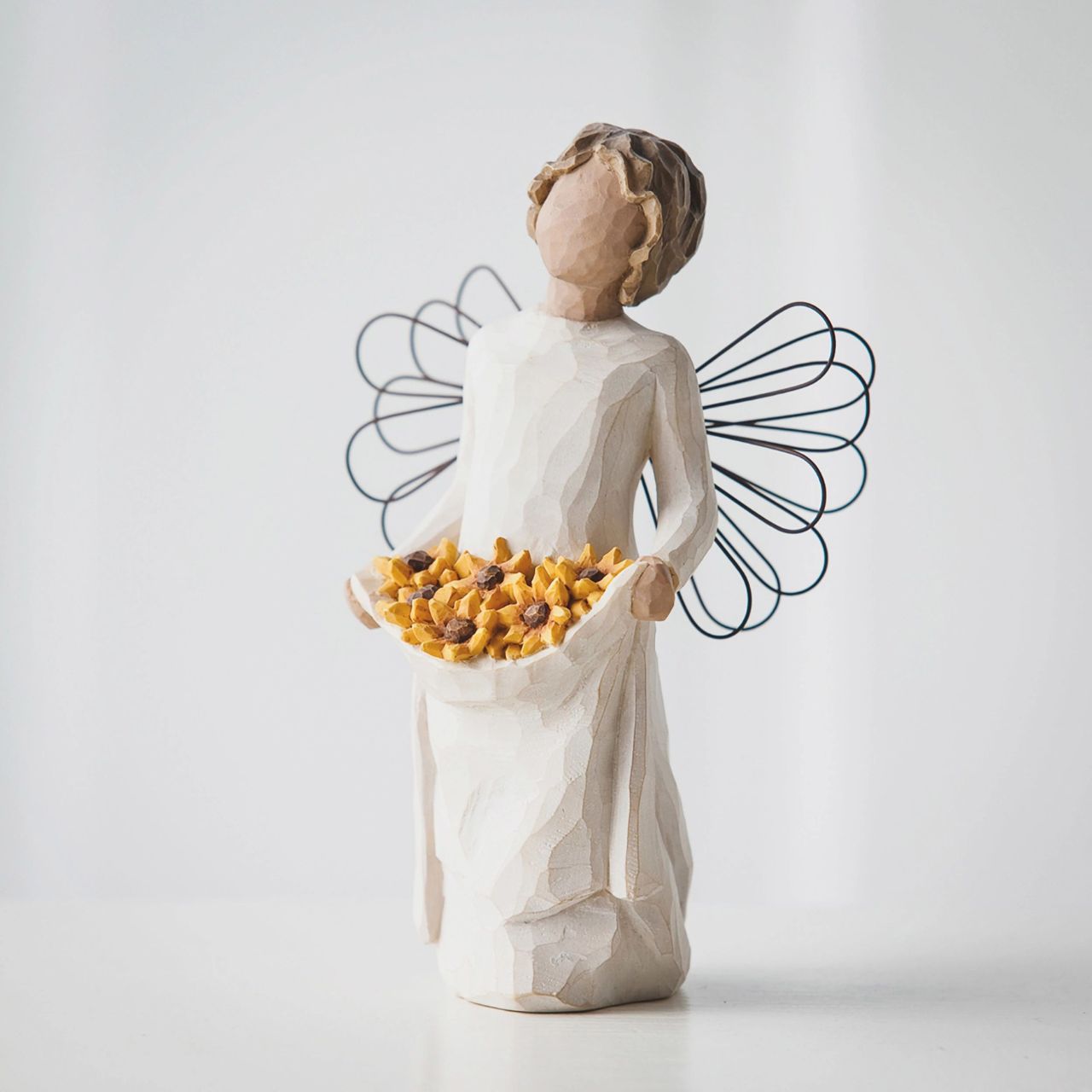 Sunshine by Willow Tree  Willow Tree is an intimate line of figurative sculptures representing sentiments of love, closeness, healing, courage, hope...all the emotions we encounter in life. "Everyone knows somebody that lights up a room when she or he walks in. You're always happy to see that person - it's somebody who captures the essence of life - who's fun to be around - who brings energy and light. Like when the sun comes out.