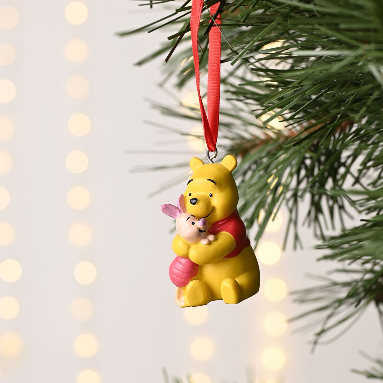 Celebrate the warmth of friendship with our Disney Resin Hanging Decoration featuring Winnie the Pooh and Piglet.