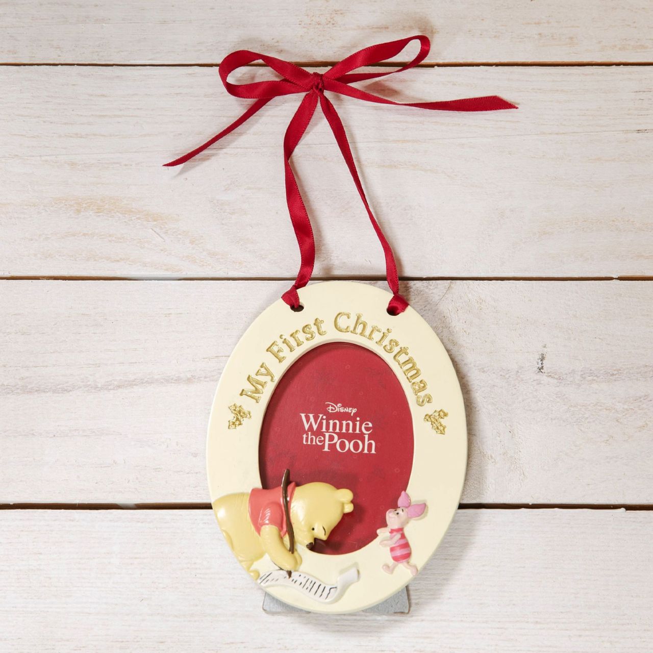 Give a precious 1st Christmas photo the perfect place to shine with this adorable Winnie the Pooh hanging photo frame. From the Winnie The Pooh Baby's First Christmas collection by Disney