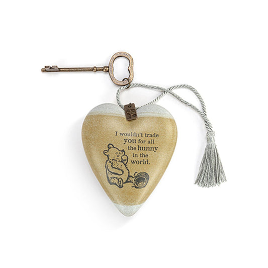 This heart-shaped ornament features a vintage-style illustration of Winnie the Pooh and the quote "I wouldn't trade you for all the bunnies in the world." Suspended from a metal key, it's a lovely gift to show someone special how much they mean to you.
