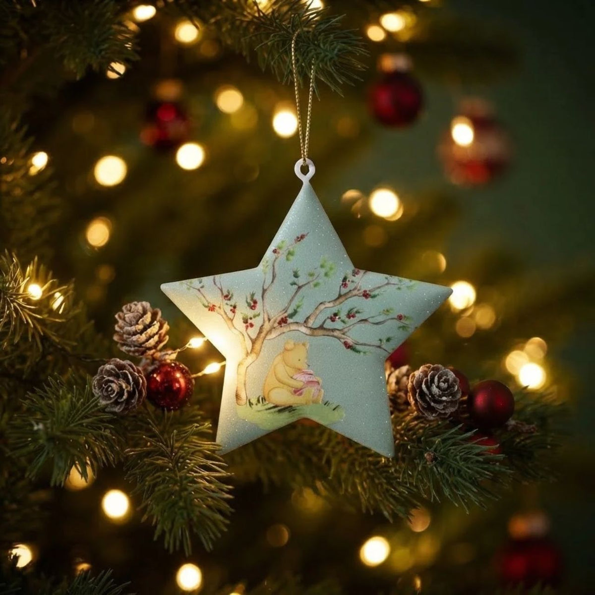 Bring timeless charm to your Christmas tree with this delightful Gisela Graham Winnie-The-Pooh &amp; Tigger hanging ornament. Featuring a whimsical star and heart design, this collectible piece celebrates beloved characters in festive style.
