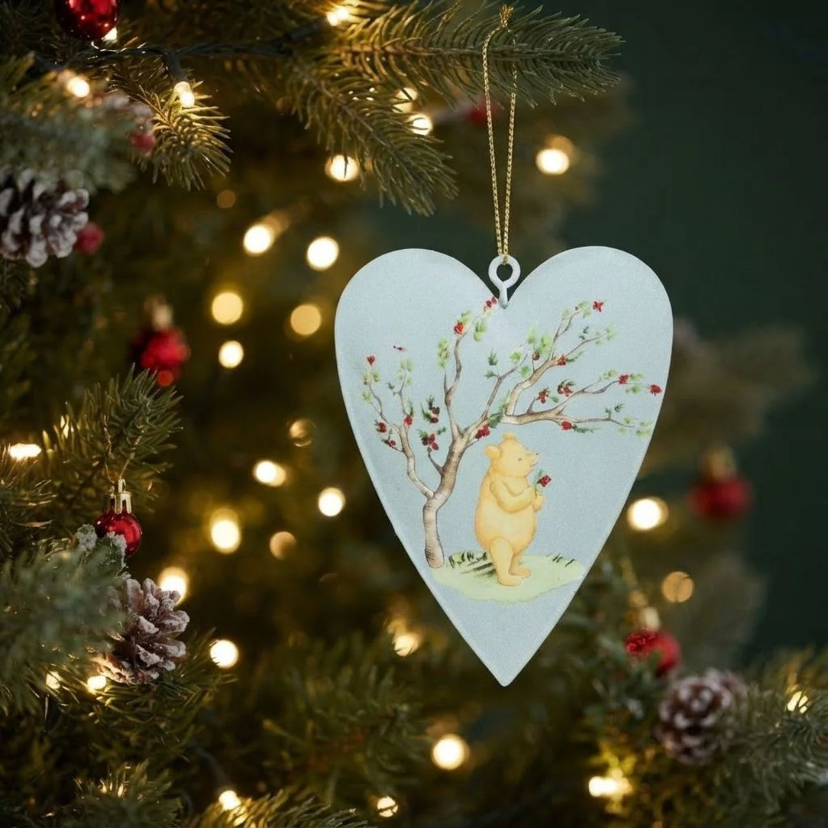 Bring timeless charm to your Christmas tree with this delightful Gisela Graham Winnie-The-Pooh & Tigger hanging ornament. Featuring a whimsical star and heart design, this collectible piece celebrates beloved characters in festive style.