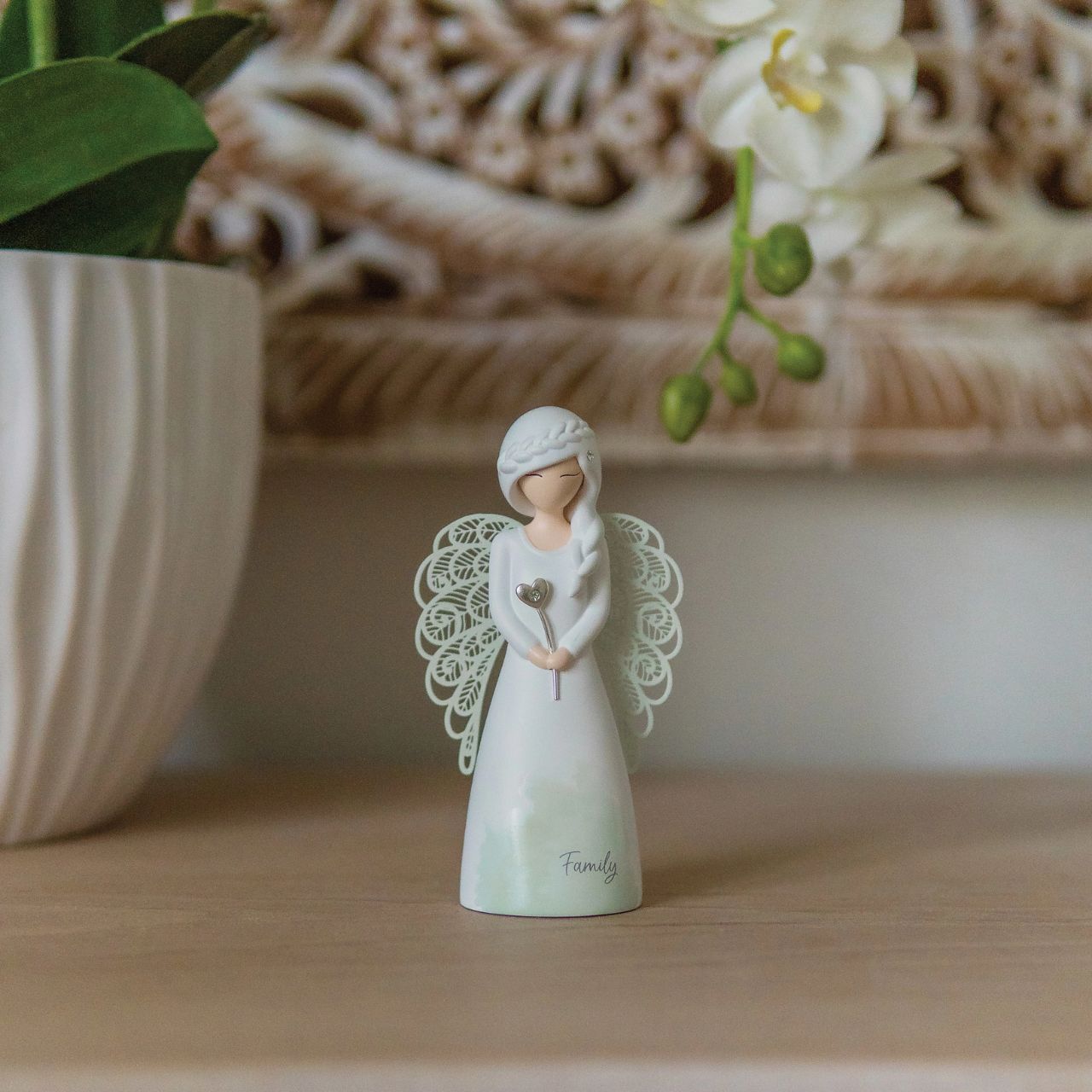 Thank You Angel Figurine - Family  Looking for a thoughtful gift that's both beautiful and meaningful? These stunning angels are the perfect way to show someone special just how much they mean to you. Standing 12.5cm tall, they are perfect as a gift and home decoration.