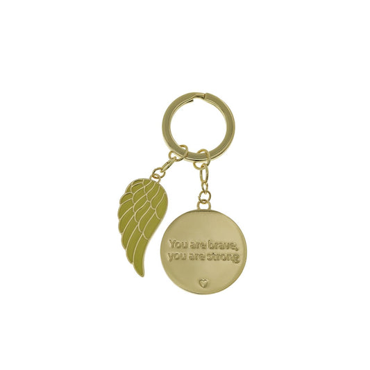 Presenting ''You are Brave'' Keychain. A blend of leather and polished metal, presented in a striking gold embossed gift box. A thoughtful reminder, honouring courage and strength, perfect for inspiring and supporting someone on their journey.