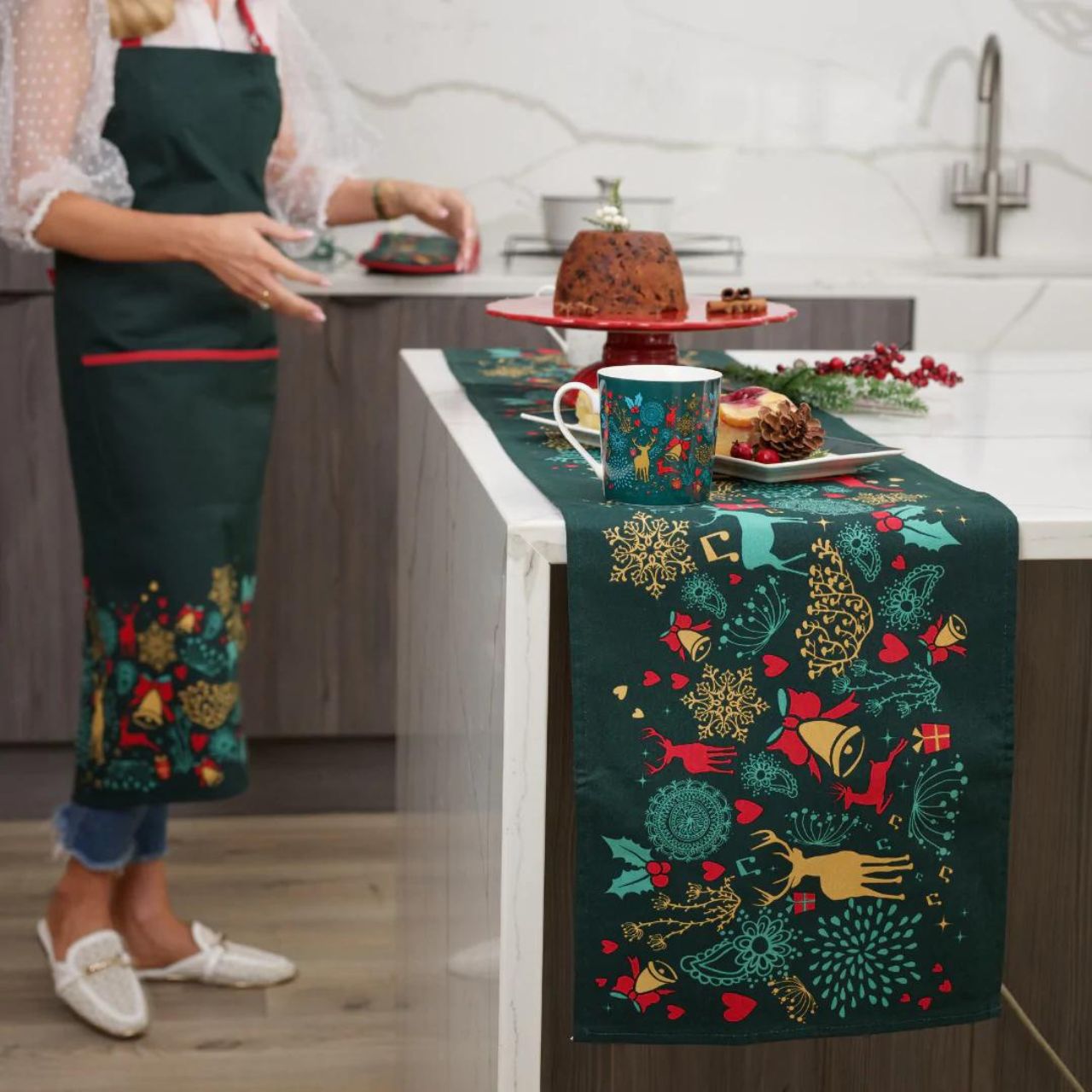 Christmas Wish Table Runner by Mindy Brownes Interiors  A beautiful table runner finished in forest green with a Christmas design that depicts some of Christmas' key elements, such as reindeer, presents, music notes, and more.  Ideal for any festive tablescape.