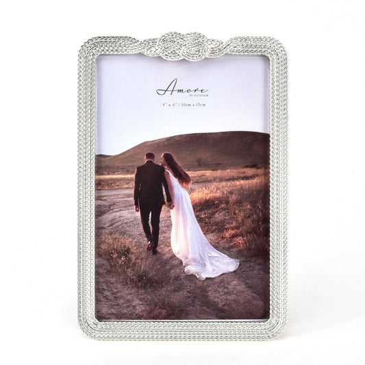 Amore Silver-Plated Infinity 3D Knot Photo Frame - 4" X 6"  Taking its name from the Italian for love, AMORE BY JULIANA® combines the romance and elegance of Italian style in fresh, contemporary and timeless designs with real sentimental value.