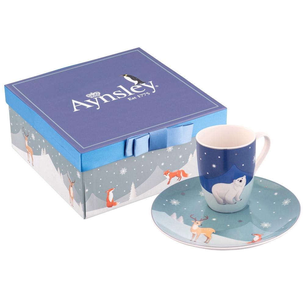 Aynsley Winter Animal Mug & Plate Set  This wintery and fun set features cool blue toned snowy landscapes and cute animal illustrations. The plate features a well for the mug and is perfect for cosy nights in. This set comes beautifully boxed in a handmade gift box with ribbon. 