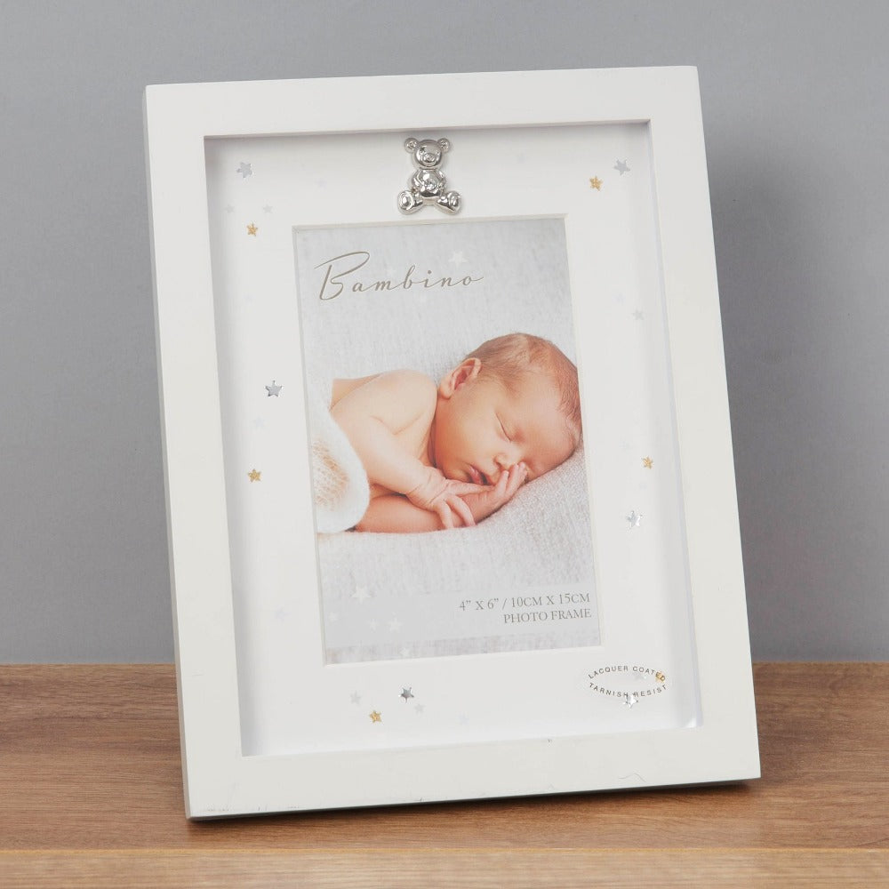 Bambino Photo Frame with Ivory Mount 4" x 6"  A gorgeous photo frame with ivory mount from BAMBINO BY JULIANA®. The frame is embellished with gold and silver foiled stars and a silver plated crystal teddy bear icon.