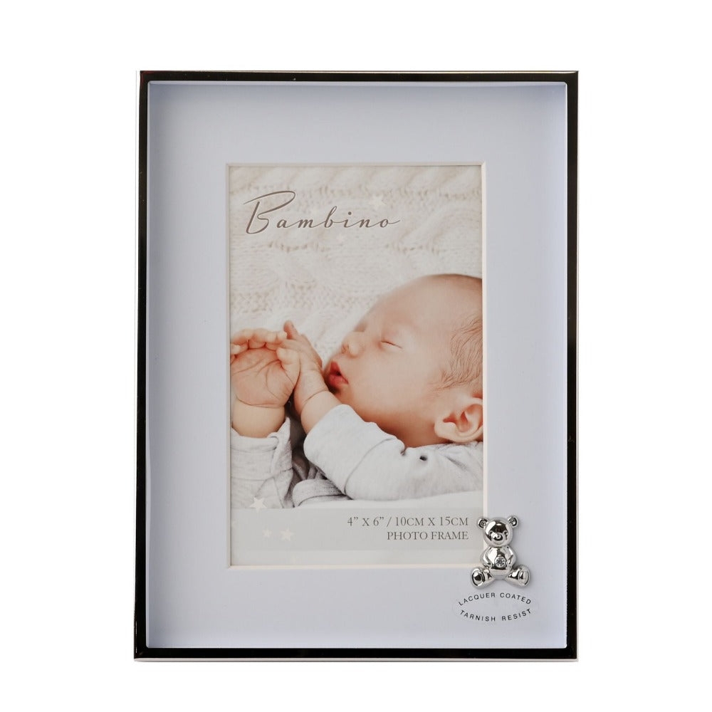 Bambino Silver Finish Frame - Teddy Blue Mount 4" x 6"  A gorgeous 4" x 6" (10 x 15 cm) nickel plated silver finish BAMBINO BY JULIANA® photo frame with a blue mount. The photo frame is embellished with a crystal finished silver teddy bear icon. Complete with a standing strut.