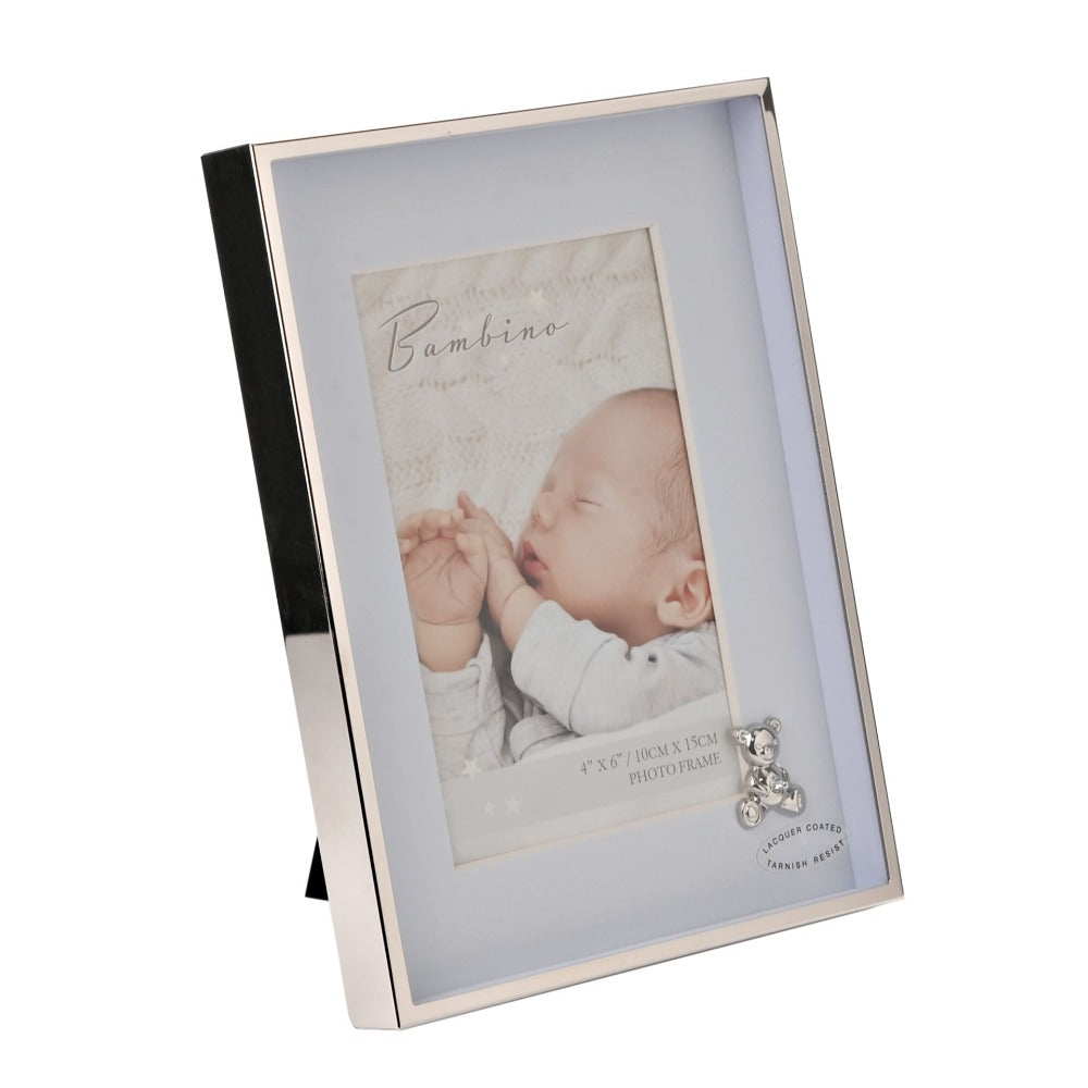 Bambino Silver Finish Frame - Teddy Blue Mount 4" x 6"  A gorgeous 4" x 6" (10 x 15 cm) nickel plated silver finish BAMBINO BY JULIANA® photo frame with a blue mount. The photo frame is embellished with a crystal finished silver teddy bear icon. Complete with a standing strut.