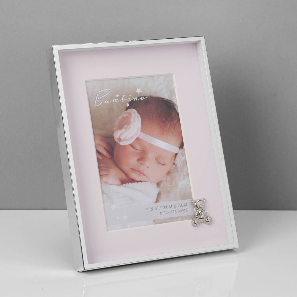 Bambino Silver Finish Frame - Teddy Pink Mount 4" x 6"  A gorgeous 4" x 6" (10 x 15 cm) nickel plated silver finish BAMBINO BY JULIANA® photo frame with a pink mount. The photo frame is embellished with a crystal finished silver teddy bear icon. Complete with a standing strut.