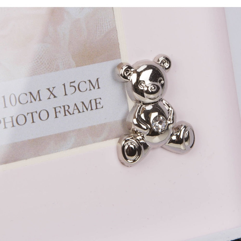 Bambino Silver Finish Frame - Teddy Pink Mount 4" x 6"  A gorgeous 4" x 6" (10 x 15 cm) nickel plated silver finish BAMBINO BY JULIANA® photo frame with a pink mount. The photo frame is embellished with a crystal finished silver teddy bear icon. Complete with a standing strut.