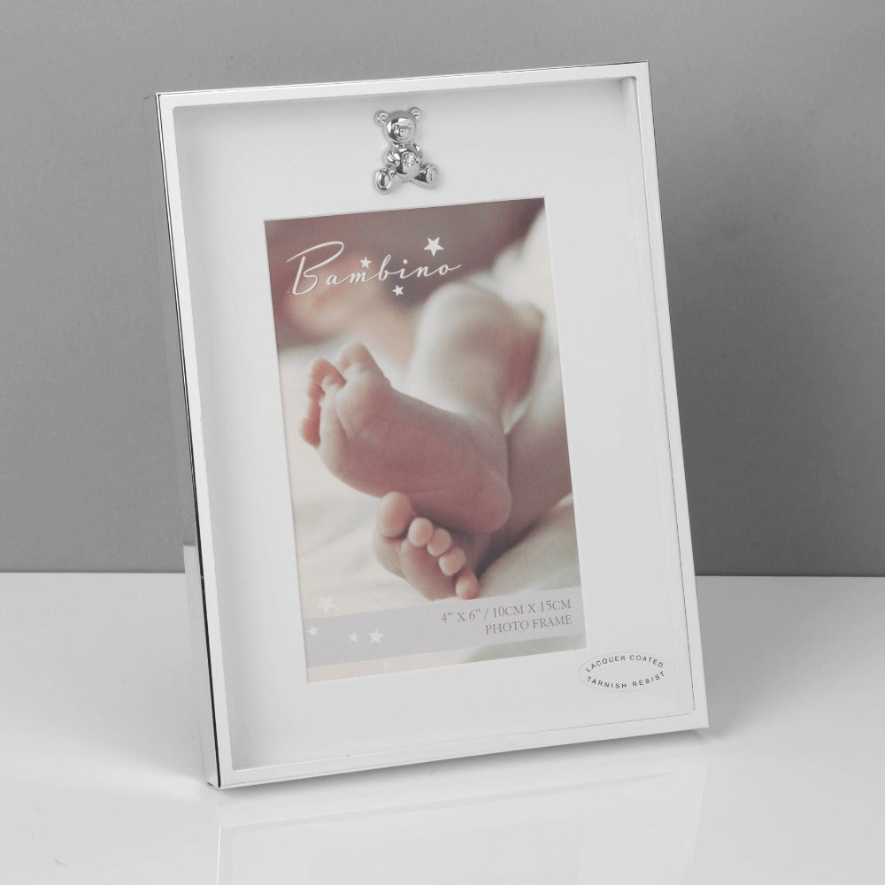 Bambino Thin Silver Plated Photo Frame 4" x 6"  A gorgeous 4" x 6" (10x15cm) silver plated photo frame from BAMBINO BY JULIANA®. The box frame is embellished with a crystal finished teddy bear icon and features a crisp white mount and standing strut.