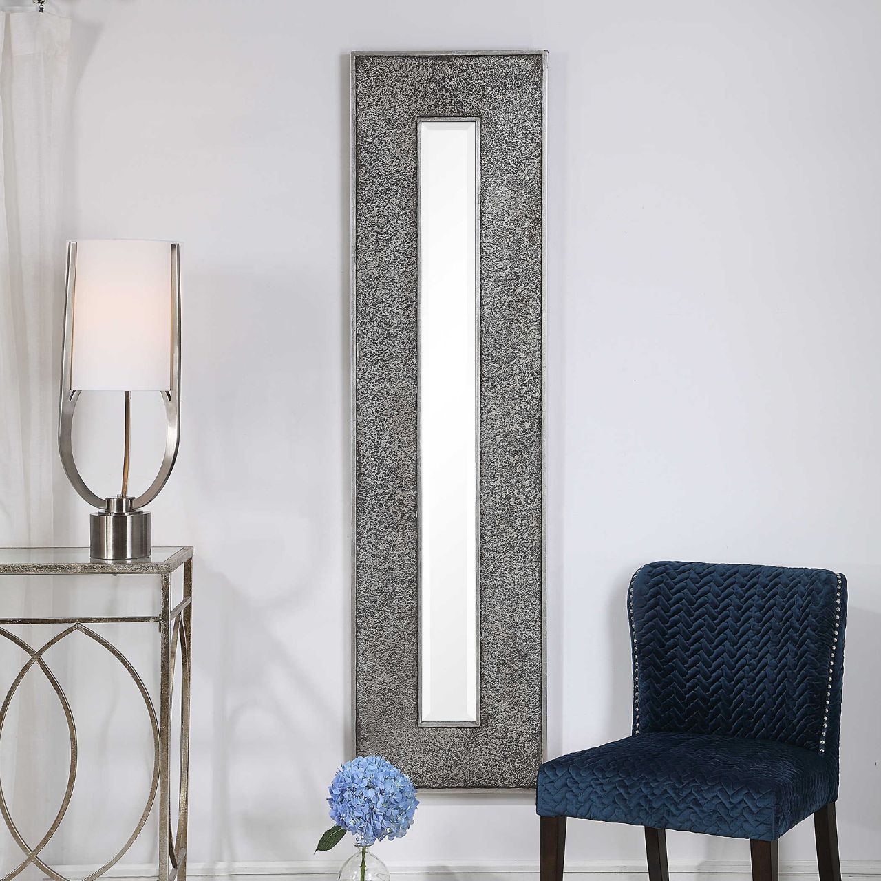 Bannon Mirror by Mindy Brownes - NEW  This rectangular mirror features a heavily textured surface finished in a metallic silver leaf with a heavy charcoal wash over a solid wood construction. This contemporary design boasts a great profile for showing individually or multiple for a bold statement. The mirror is bevelled and can hang vertically and horizontally.