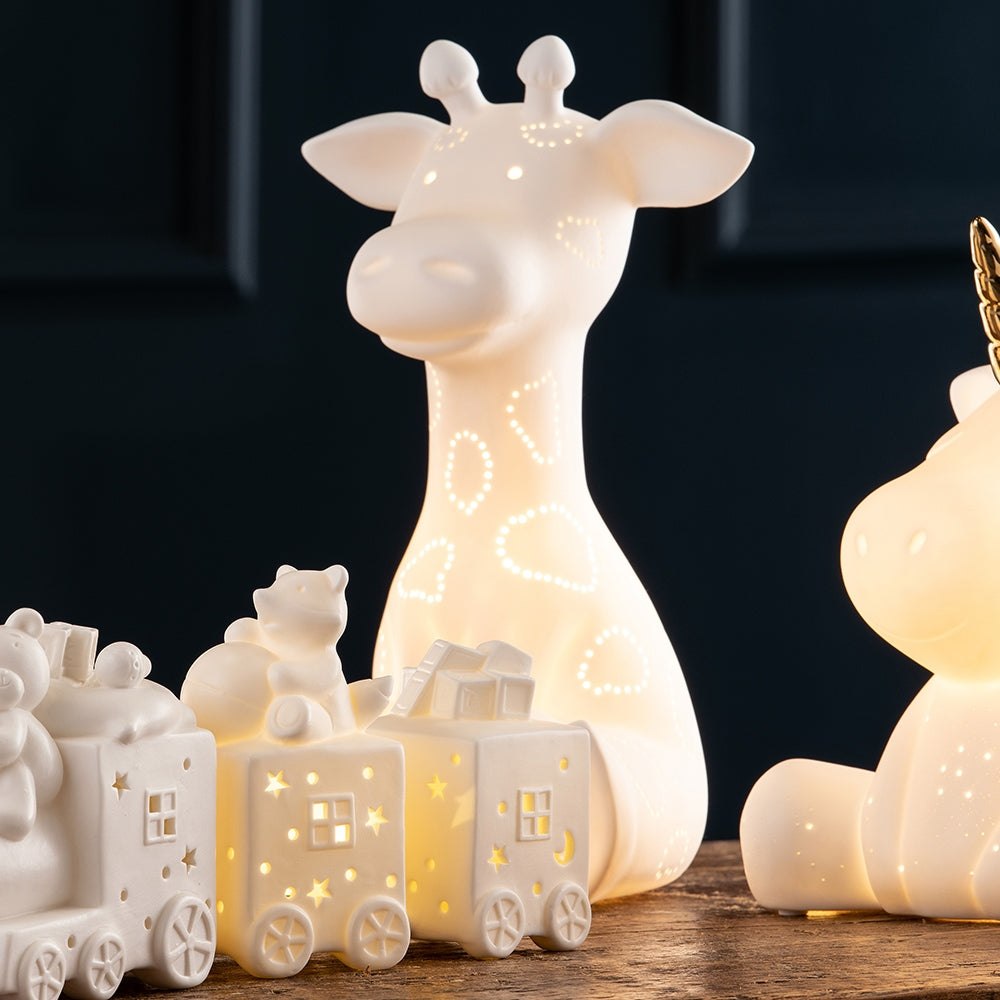 Belleek Living Giraffe Luminaire  The Belleek Living Luminaire lamps emit a soft warm glow highlighting the delicate surface decoration and piercings, creating beautiful mood lighting for your home.