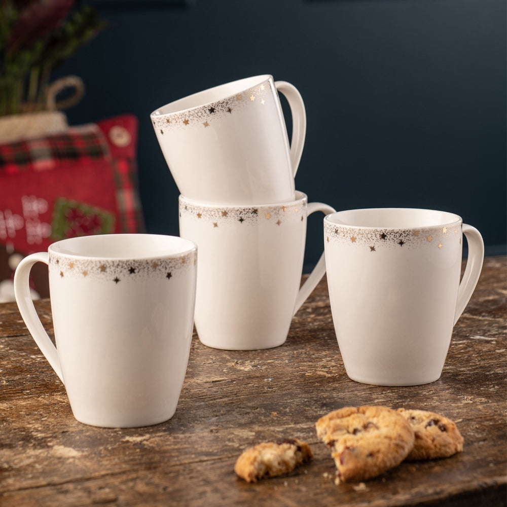 Belleek Living Stardust Set of 4 Mugs  Stardust set of 4 mugs feature a delicately stippled gold band with scattered gold accent stars adorning the edge.