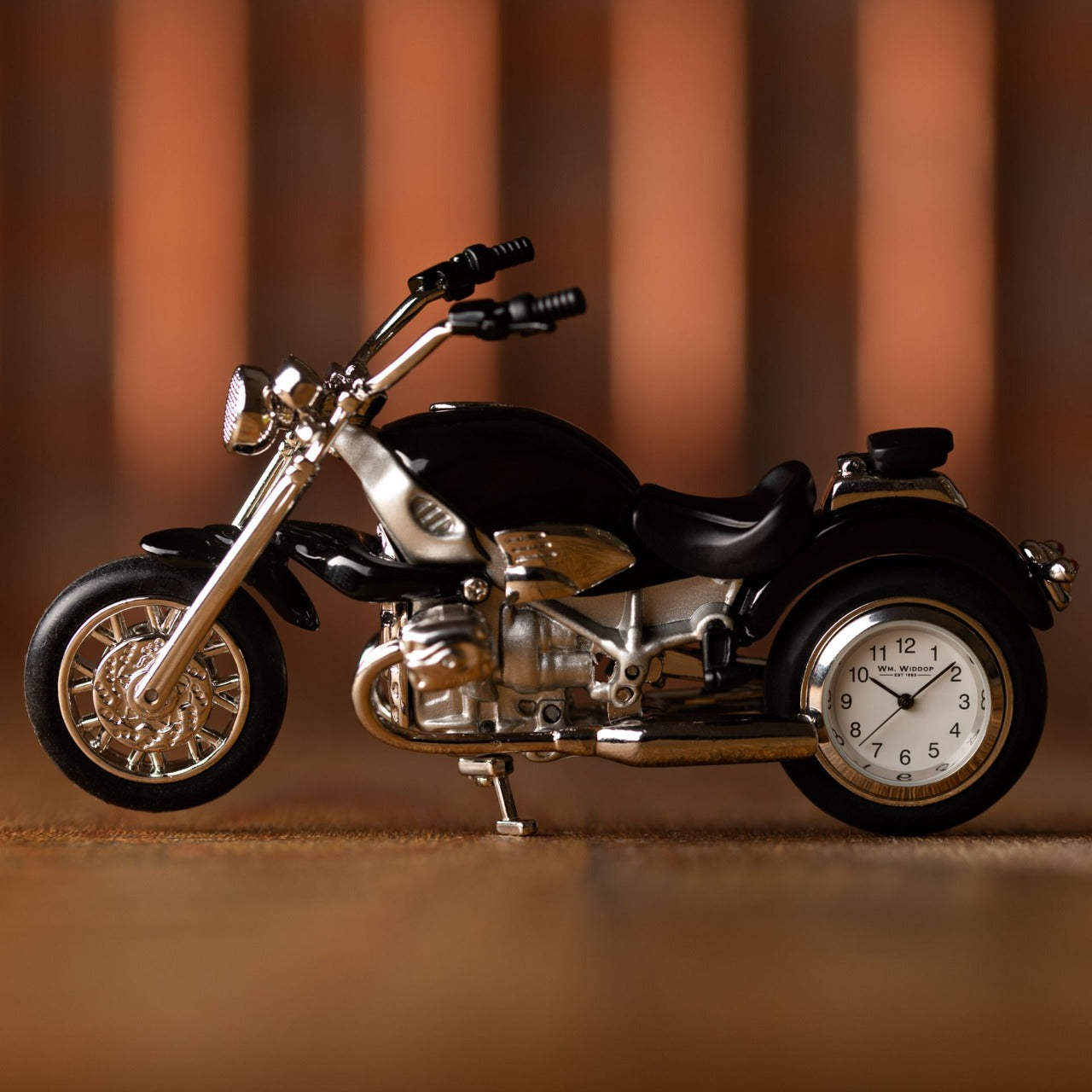 Miniature Clock Black Motorbike  Bring a unique and quirky touch to the home with this stylish miniature clock made with great attention to detail.  The miniature motorbike clock is a great gift for someone who loves iconic motorbikes.
