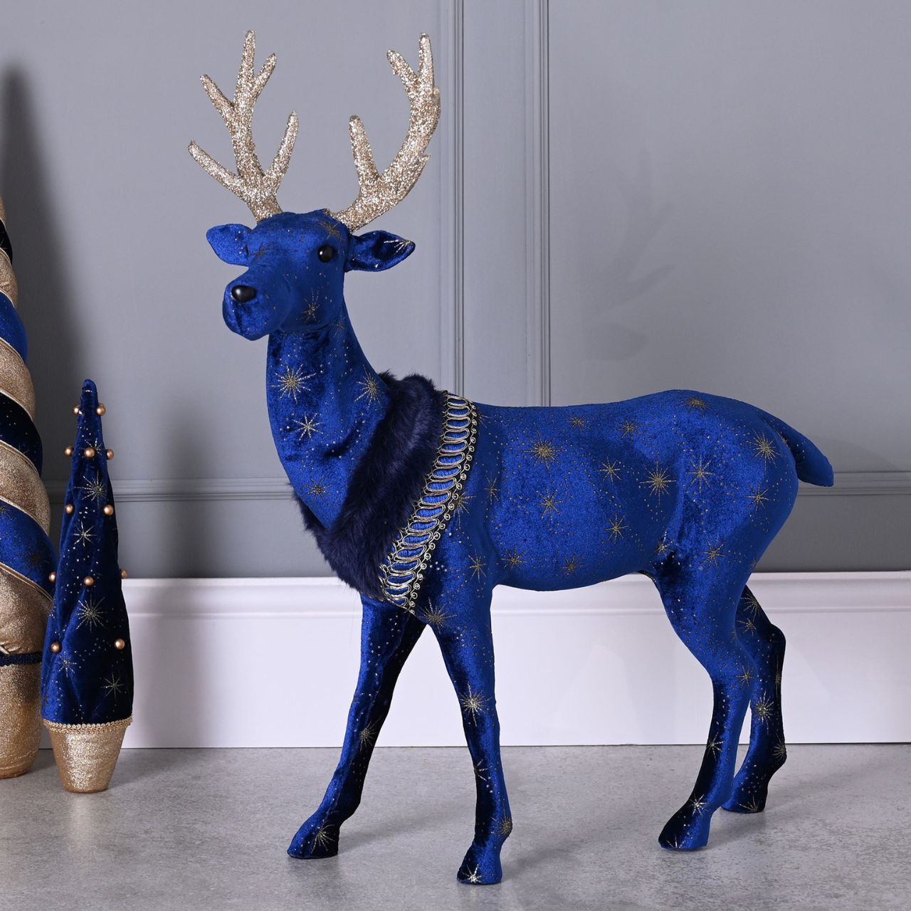 Christmas Celestial Blue and Gold Reindeer Large  A large celestial blue and gold reindeer.  This standout decoration will help to create a magical Winter Wonderland at home this festive period.