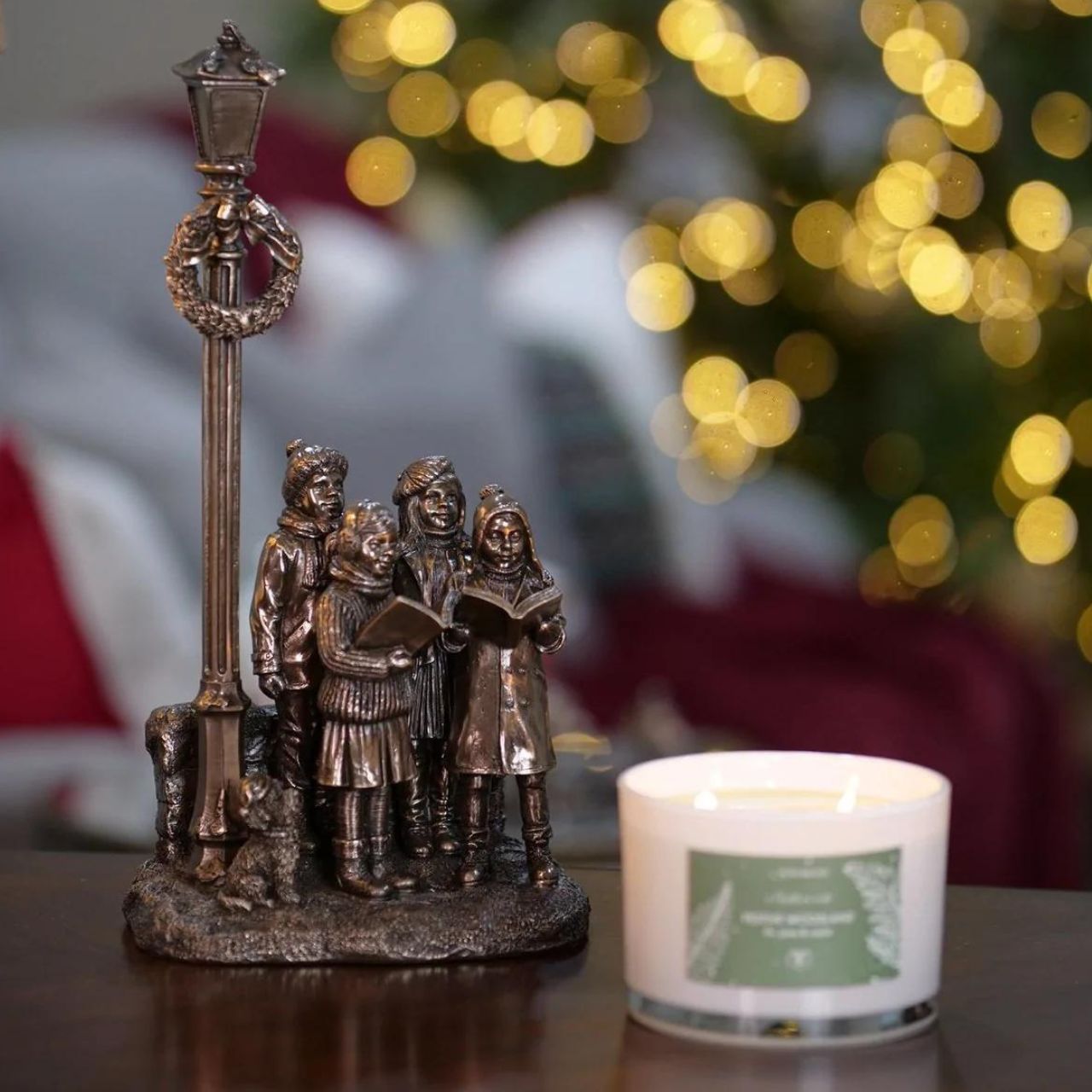 Genesis Ireland Christmas Carol Singers  A stunning ornament that is sure to bring festive cheer to your home. A beautiful bronze coloured Christmas decoration, by Genesis Ireland. Depicting a group of carol singers spreading the joy of Christmas. Let the magic of Christmas fill your home with this gorgeous sculpture for many years to come.