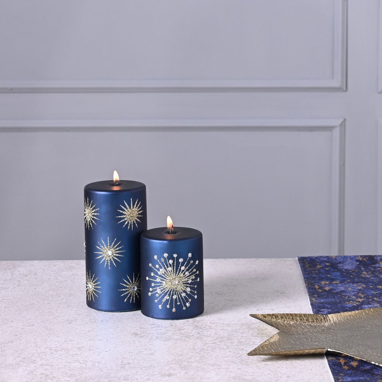 Celestial Starburst Pillar Christmas Candle  Starburst celestial pillar candle by THE SEASONAL GIFT CO®.  These glistening candles will help to create a magical Winter Wonderland at home this festive period.