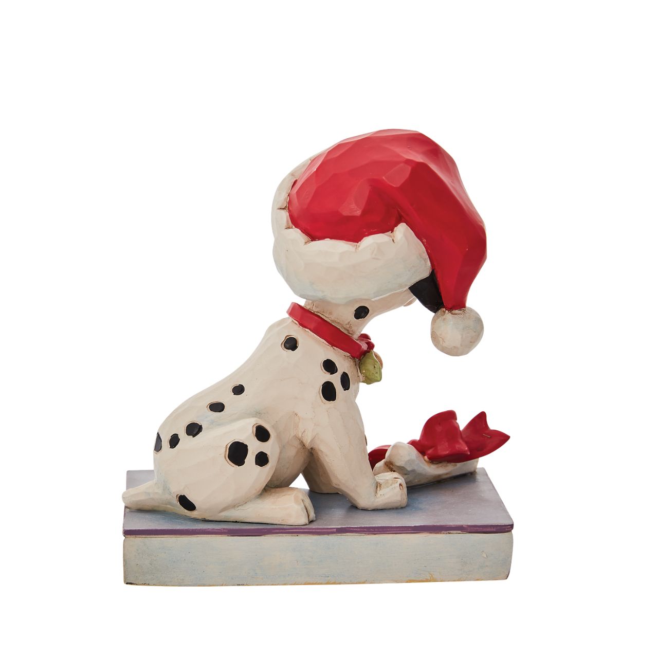 Jim Shore Christmas Lucky Personality Pose Figurine  With one hundred and one brothers and sisters, Christmastime is a delight for Lucky. Enjoying the winter in London, Lucky savours a bone while he wears holly and a Santa hat decked out in Jim Shore's intricate detail.