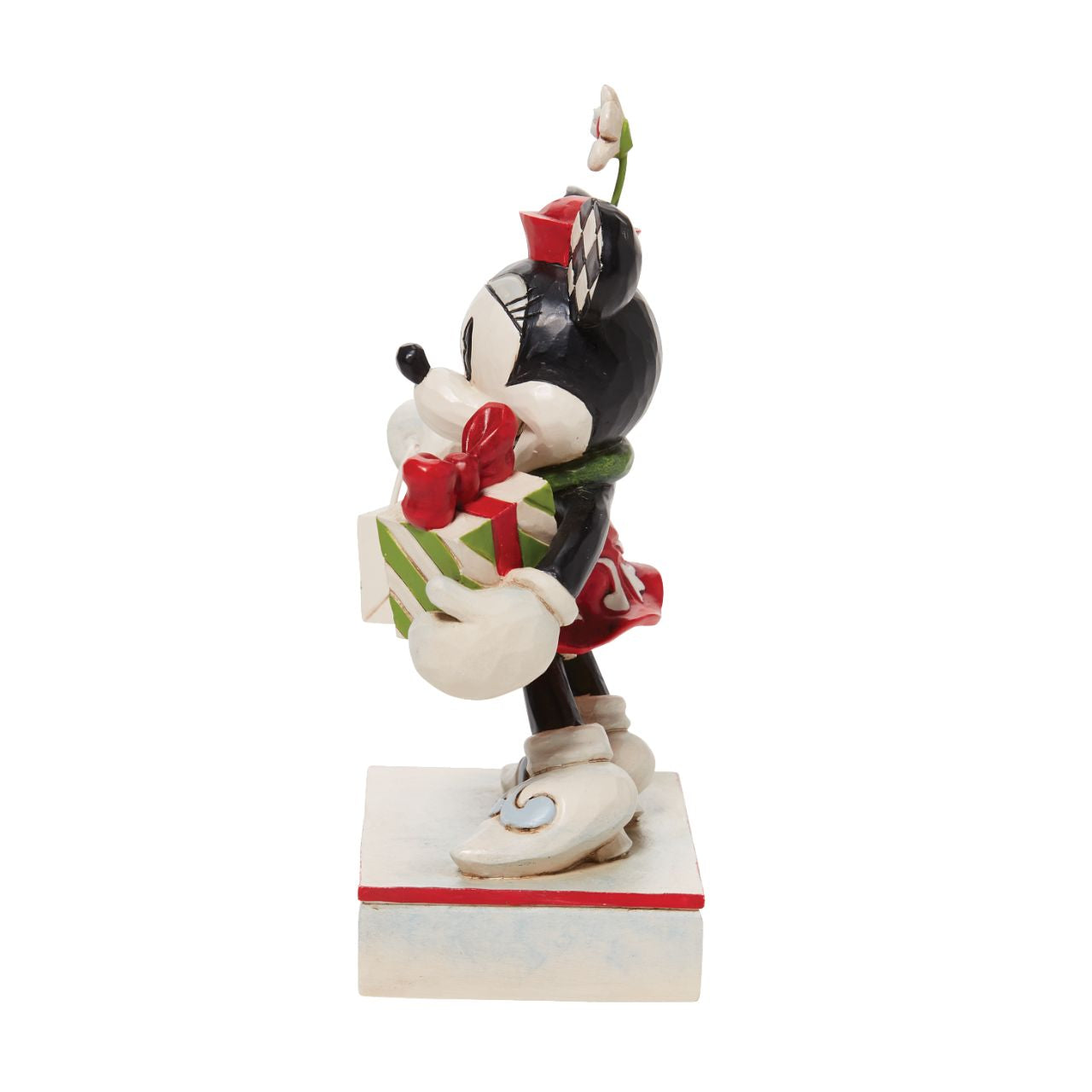 Jim Shore Christmas Mickey with Stack of Presents Figurine  Disney comes home for the holidays with this festive figurine by Jim Shore. Donning a candy cane striped scarf, Mickey wears a neighborly smile as he carries a towering stack of presents. The cheerful mouse boasts a holly brimmed Santa hat.