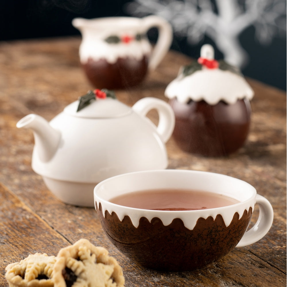 Christmas Pudding Tea for One by Belleek Living   Our fun Tea for One is a new addition to our Christmas Pudding Tableware Collection. The teapot sits neatly on top of the teacup, which has holly painted inside the base.