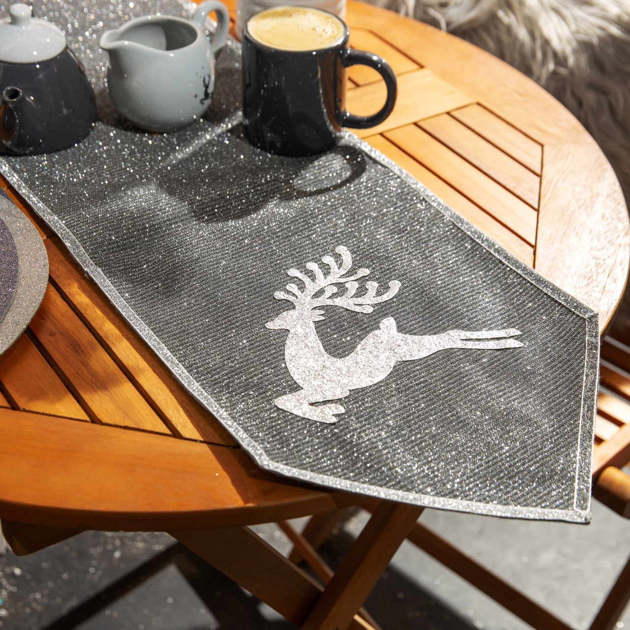 Christmas Silver Table Runner Reindeer Detail  Bring some shimmering festive luxury to the dinner table with this silver table runner. From the Moonlight Magic collection by Santa's Workshop - create all the spine-tingling twinkle of a winter’s night at home.