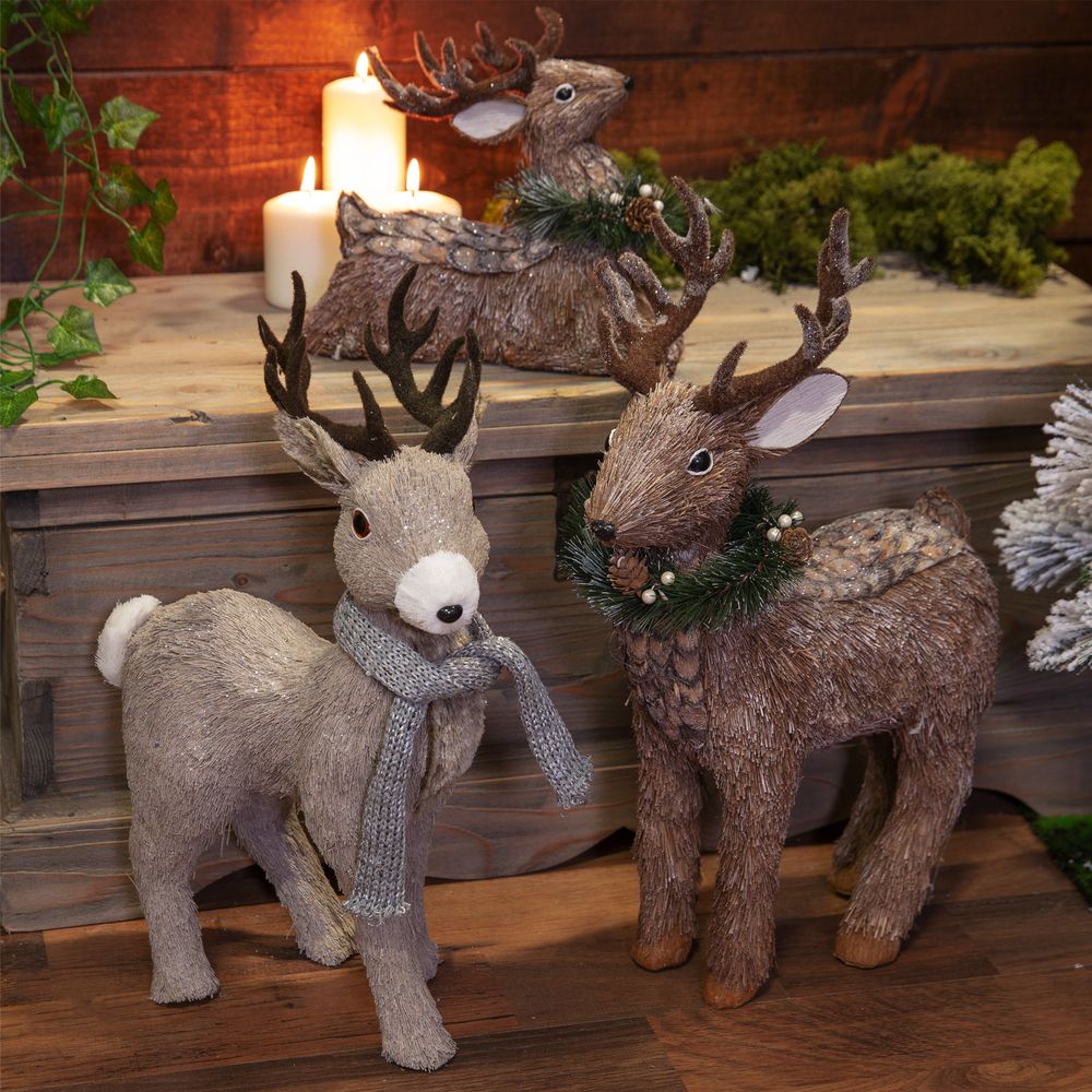 Christmas Sitting Reindeer Ornament  Create a rustic and comforting Christmas woodland decor theme with this handmade straw reindeer figurine. From the Enchanted Forest collection by Santa's Workshop - create your own winter wonderland.