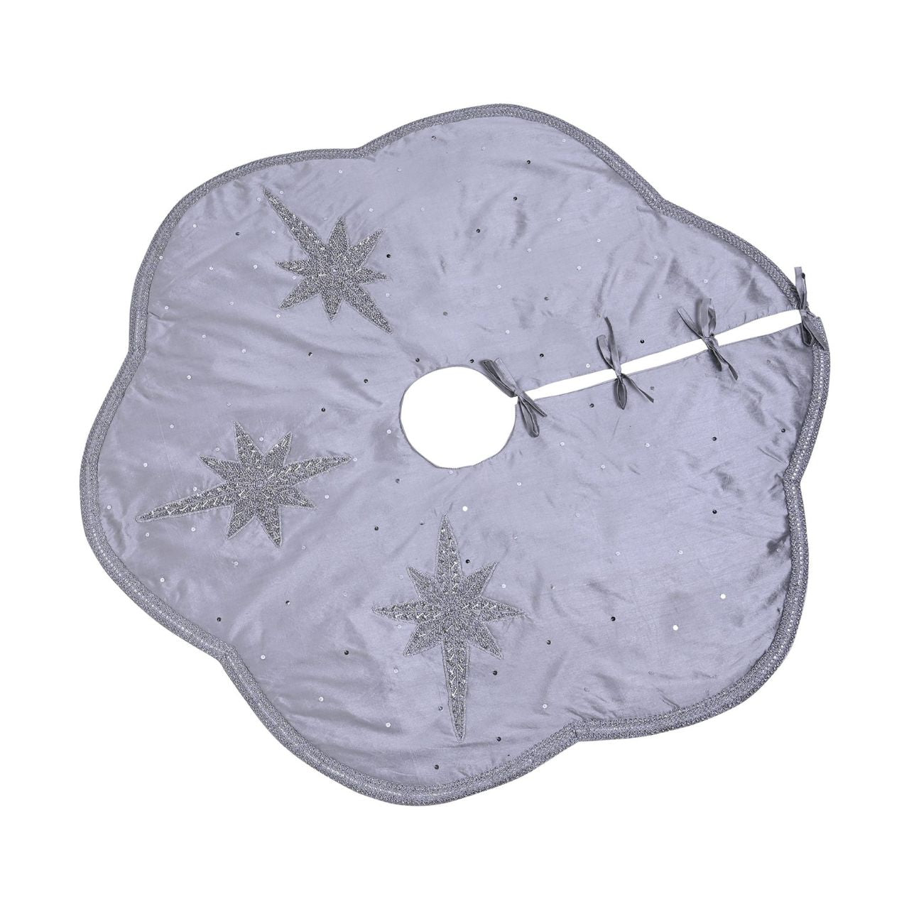 Christmas Tree Skirt with Scalloped Edge Silver Star Hand Embellished  A silver star hand embellished Christmas tree skirt with scalloped edge.  This standout accessory wraps itself around Christmas trees to accentuate its decoration.