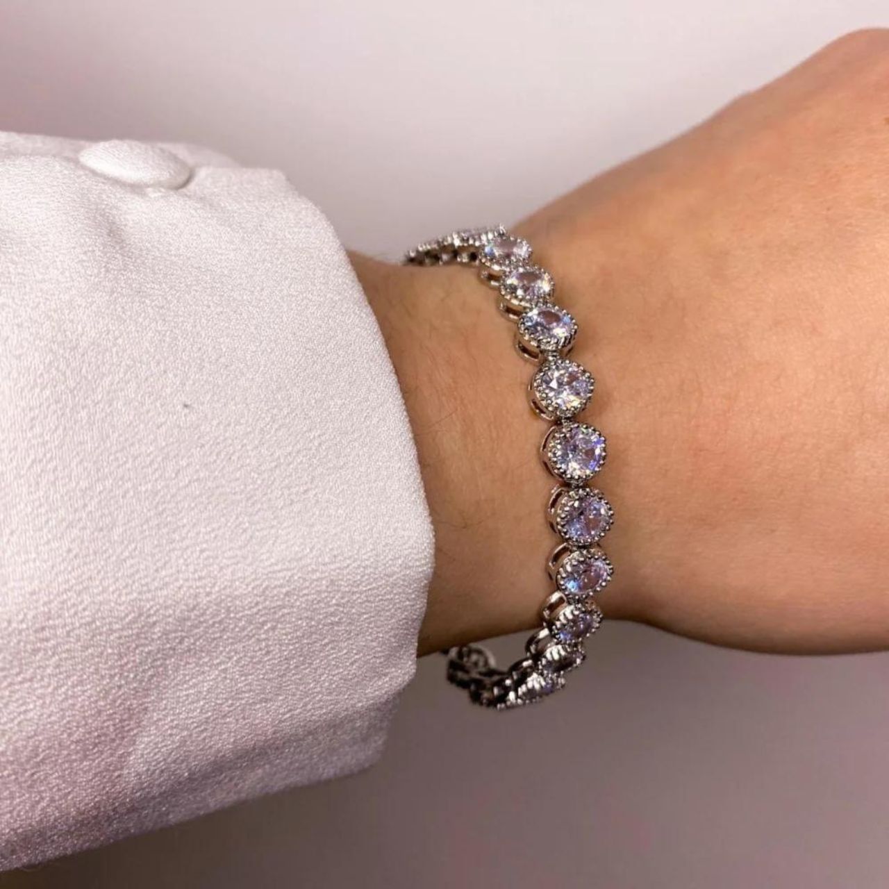 Danna Silver Plated Tennis Bracelet by Knight & Day  Beautiful rhodium plated tennis bracelet with CZ stones. Fold over clasp fastening.