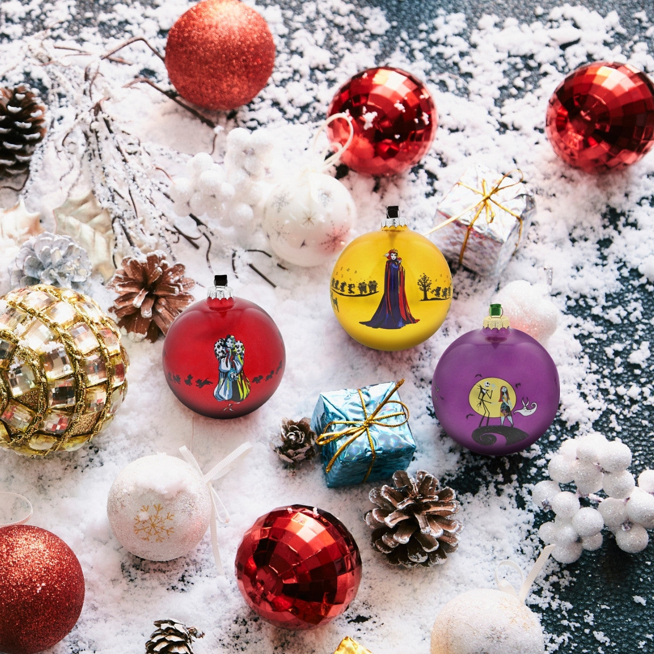 Disney Christmas Bauble Collection A Forest Of Thorns - Maleficent Bauble  The Mistress of Evil, Maleficent stands out against the Princess Aurora amongst a forest of thorns in this glass bauble. This fabulous Sleeping Beauty keepsake would make a lovely unique gift for a friend, or a self-purchase to brighten up the home. Presented in a branded window box.