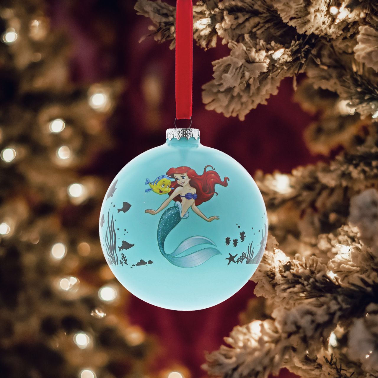 Disney Christmas Bauble The Little Mermaid Life is Bubbles  Ariel swims under the sea with Flounder in this beautiful glass bauble. This Little Mermaid treasured keepsake would make a lovely unique gift for a friend, or a self-purchase to brighten up the home.