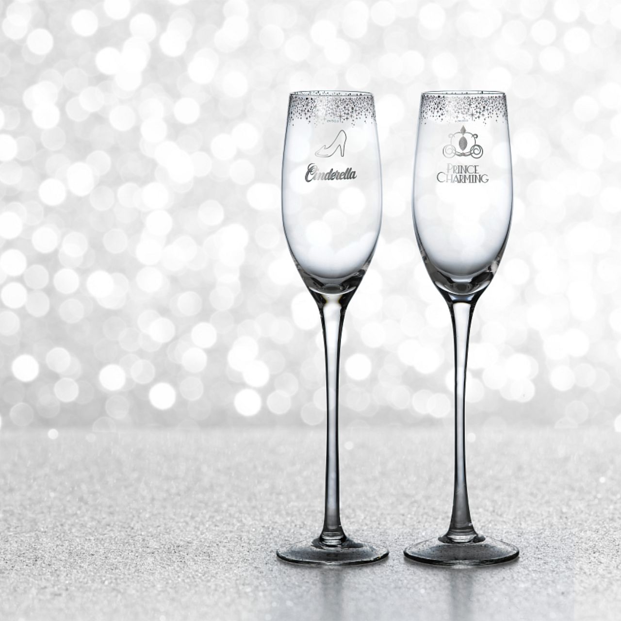Disney Cinderella Wedding Toasting Glasses  Raise a toast in Disney style with our Cinderella and Prince Charming glasses. The set of two glasses are the perfect gift and keepsake for the happy couple to use for their fairy tale wedding.