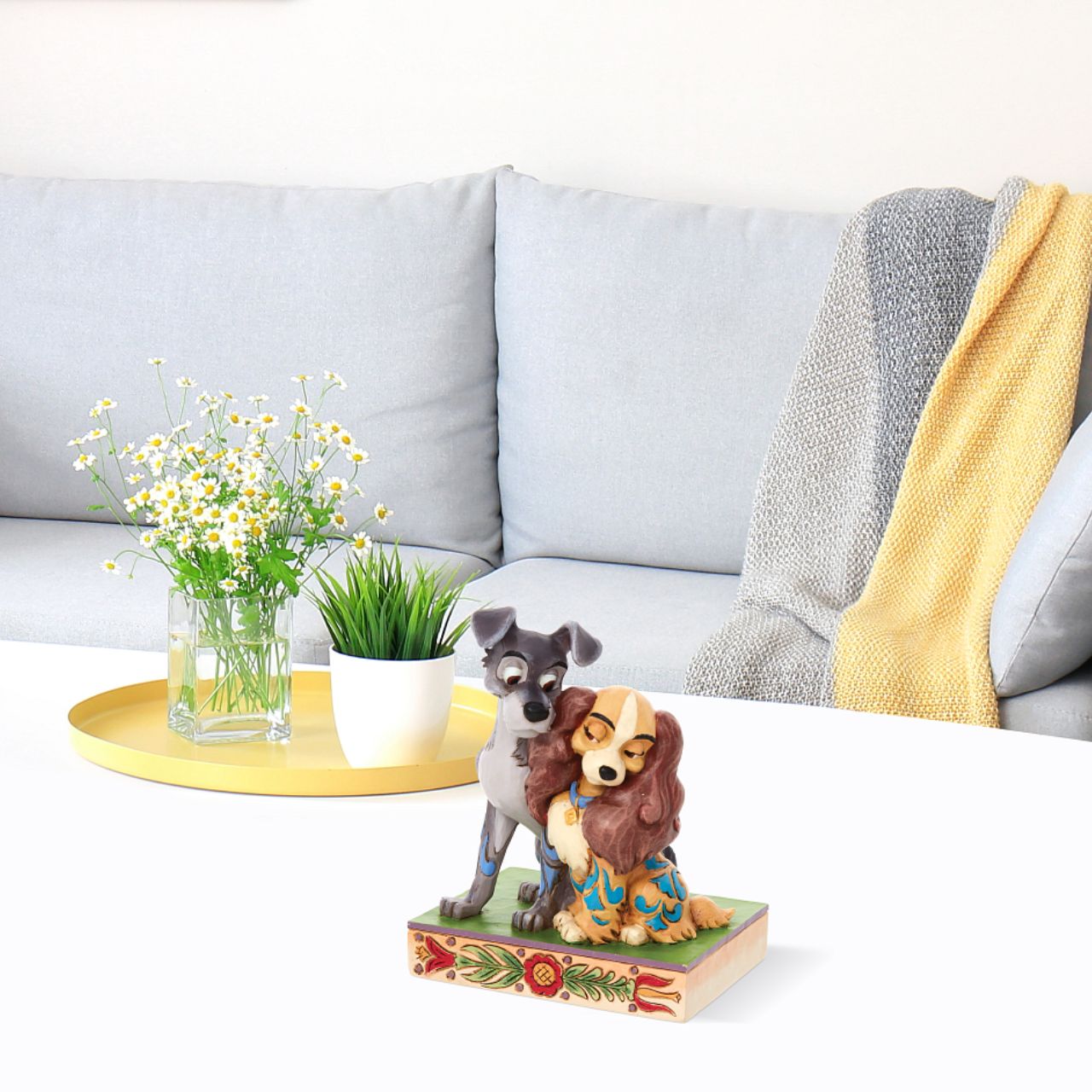 Jim Shore Disney Lady & the Tramp Love Figurine  With a love story as pure as gold, this pair of precious pups snuggle together sweetly. With intricate Jim Shore rosemaling and inspiring intimacy, this Lady and the Tramp piece steals hearts. This enchanting piece is a charming addition to any room.