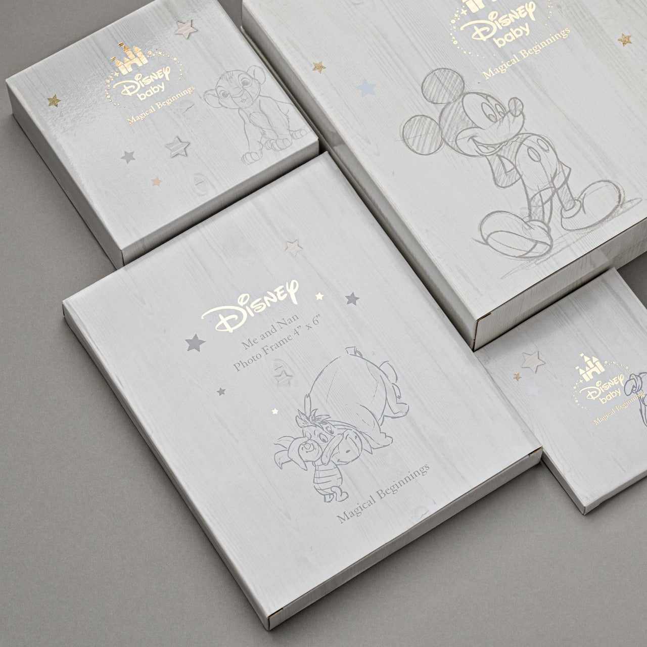Disney Magical Beginnings Photo Album 4" x 6" Mickey Mouse  Add a touch of magic to your every day with this Magical Beginnings Photo Album.  As part of our range of classic Disney illustration giftware, this photo album displays a beautiful depiction of the classic Disney character, Mickey Mouse, 'Handsome Little Boy' gold glitter lettering, space for fifty 4" x 6" photos, personalisable title page and a blue bow closure.