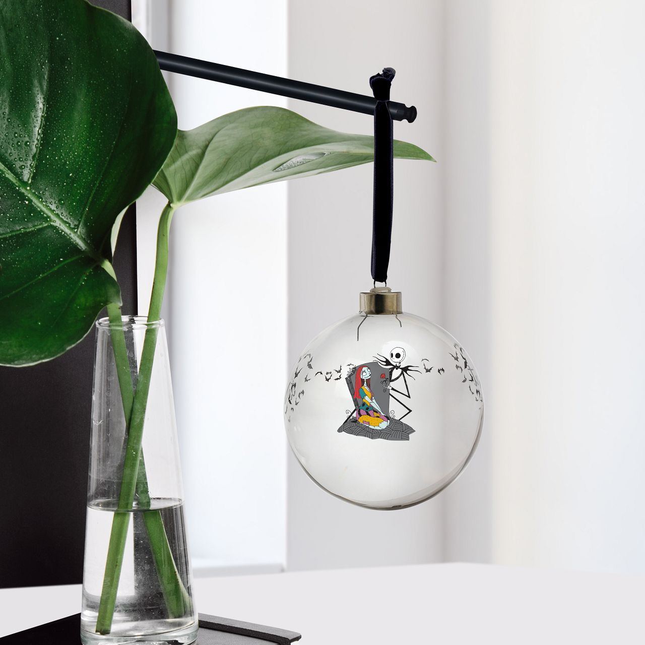 Disney Christmas Bauble Nightmare Before Christmas Bauble  This glass Nightmare Before Christmas bauble is the perfect gift to remind the happy couple that their eternal love is simply meant to be. The bauble is strung with black ribbon and is presented in a Disney branded gift box.