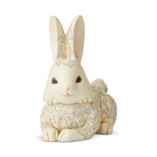 Jim Shore White Woodland Bunny Garden Statue  Decorated with Jim Shore's distinctive folk-art designs, this Bunny Garden Statue is a light-hearted accent to any outdoor setting. Handcrafted with Jim's signature attention to detail, this charming design is specially treated for outside display.