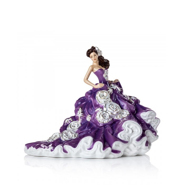 English Ladies Company Amethyst Enchantment  Amethyst Enchantment is our brand new figurine to our English Ladies Co range. Designed and modelled by Valerie Annand, our master painter Dan Smith has created this wonderful colourway. Her rich purple dress is decorated with Mother of Pearl highlights and 24 real Swarowski® crystals, she really is a beauty.