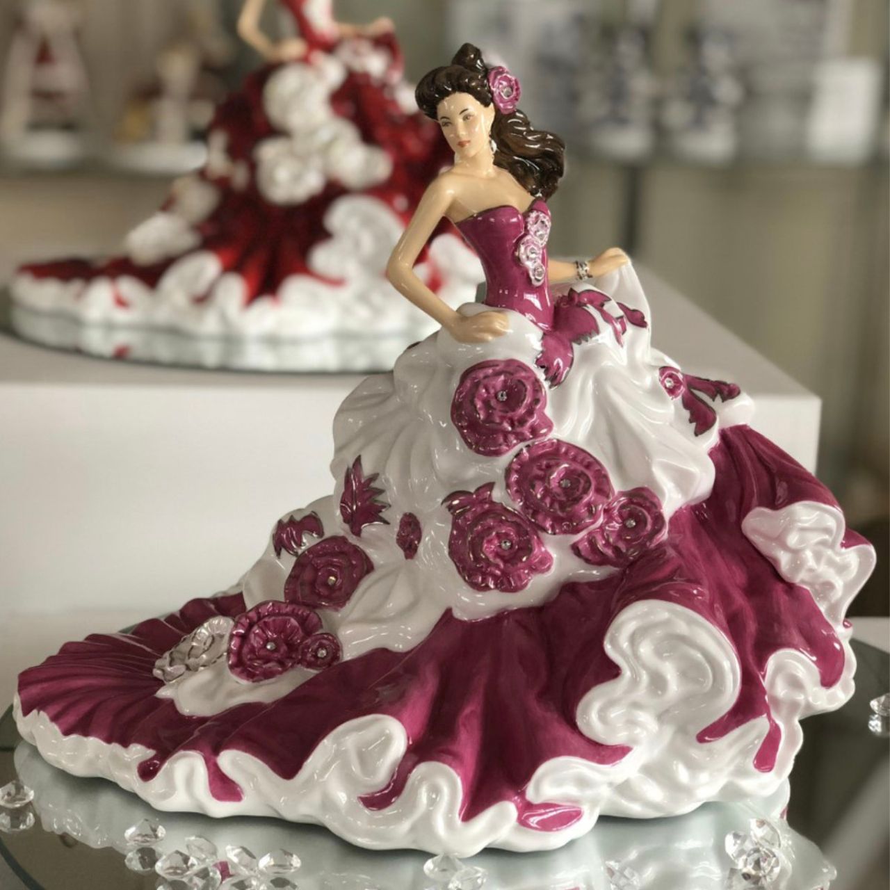 English Ladies Sweet Enchantment  Our fabulous Sweet Enchantment figurine is the latest figure in the English Ladies Co range. Designed and modelled by Valerie Annand, every piece is hand made and decorated and features 24 real Swarowski® crystals. 