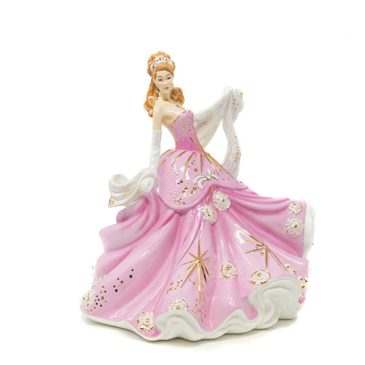 English Ladies Sweet Radiance  From our English Ladies Co Radiance Collection, the Sweet Radiance figurine. This figurine has been modelled by Valerie Annand and hand-painted and decorated by our Master Painter Dan Smith. The Sweet Radiance figurine comes in a light floral pink colourway and has been detailed with Mother of Pearl lustre and real gold highlights. 