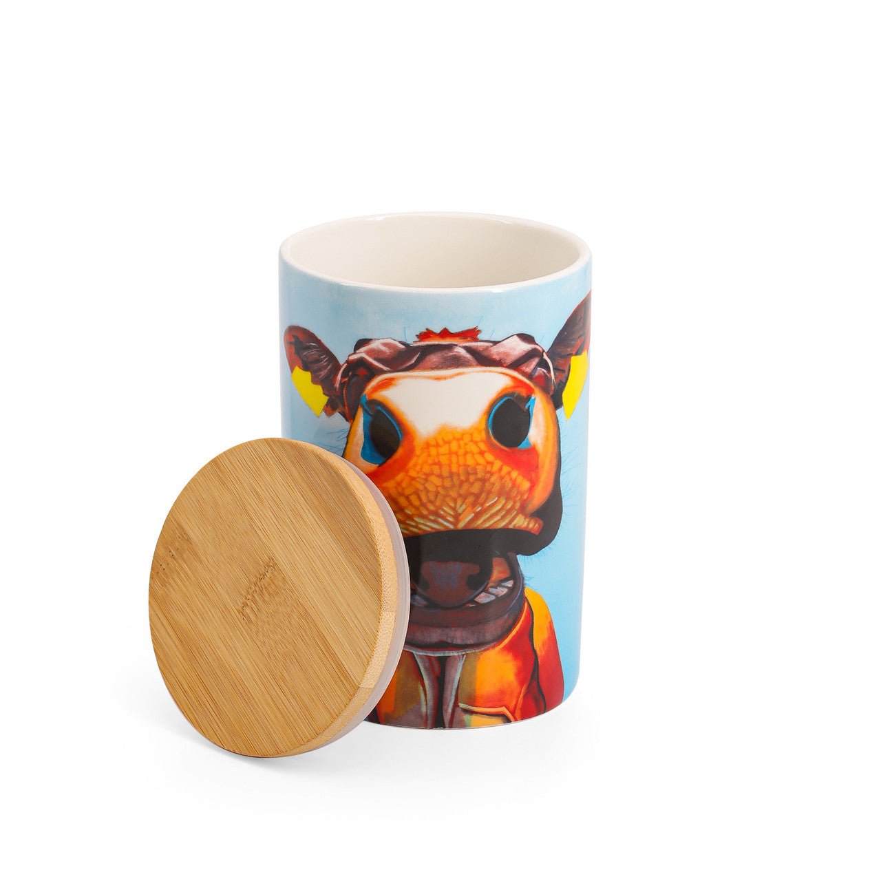 Tipperary Crystal Eoin O'Connor Cow Storage Jar - In Stitches - NEW 2022  EOIN O’CONNOR’S eclectic style and striking use of colour makes his work instantly recognisable. While his command over scale and perspective is rooted in his architectural training, his passion remains firmly grounded in creating strikingly vibrant paintings which echo his unique view of Irish life.
