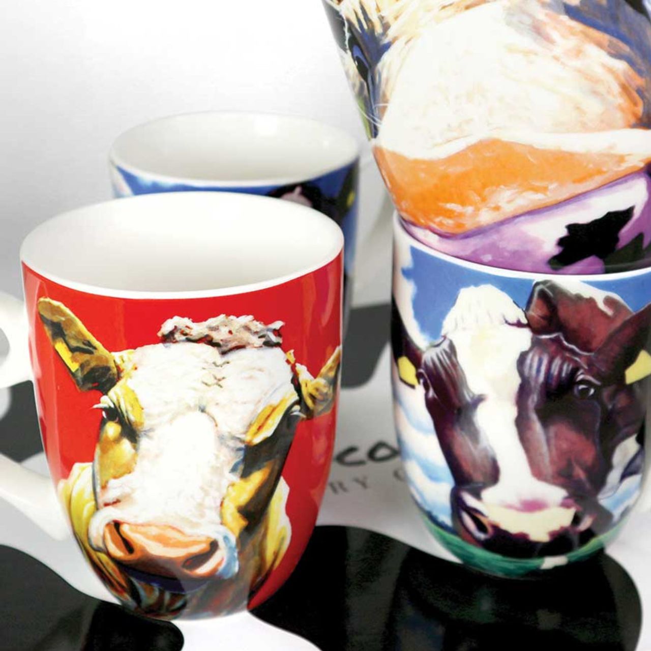 Eoin O'Connor Set Of 4 Mugs  Irish artist Eoin O'Connor bone china, set of 4 mugs from Tipperary Crystal.