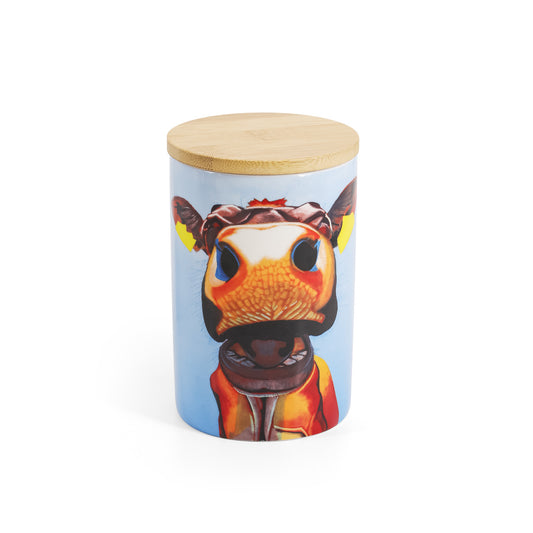 Tipperary Crystal Eoin O'Connor Cow Storage Jar - In Stitches - NEW 2022  EOIN O’CONNOR’S eclectic style and striking use of colour makes his work instantly recognisable. While his command over scale and perspective is rooted in his architectural training, his passion remains firmly grounded in creating strikingly vibrant paintings which echo his unique view of Irish life.
