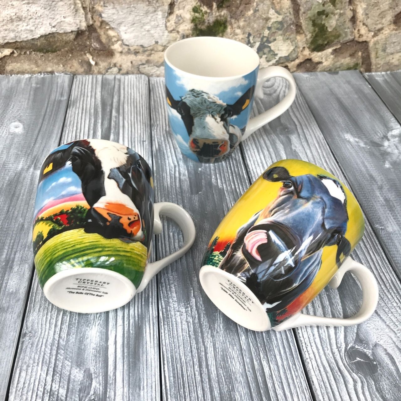 Eoin O'Connor Set of 6 Hatbox Mugs  EOIN O’CONNOR’S eclectic style and striking use of colour makes his work instantly recognisable. While his command over scale and perspective is rooted in his architectural training, his passion remains firmly grounded in creating strikingly vibrant paintings which echo his unique view of Irish life.