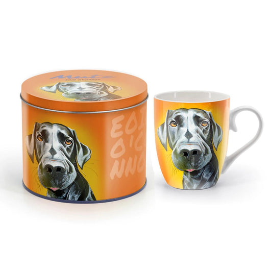 Eoin O'Connor Mutz Mug - Mr. Lover  New Mutz mugs are bursting with colour and they come in a funky tin.  Tipperary Crystal are delighted to present the Mutz Collection Irish artist Eoin O'Connor.  EOIN O’CONNOR’S eclectic style and striking use of colour makes his work instantly recognisable. While his command over scale and perspective is rooted in his architectural training, his passion remains firmly grounded in creating strikingly vibrant paintings which echo his unique view of Irish life.