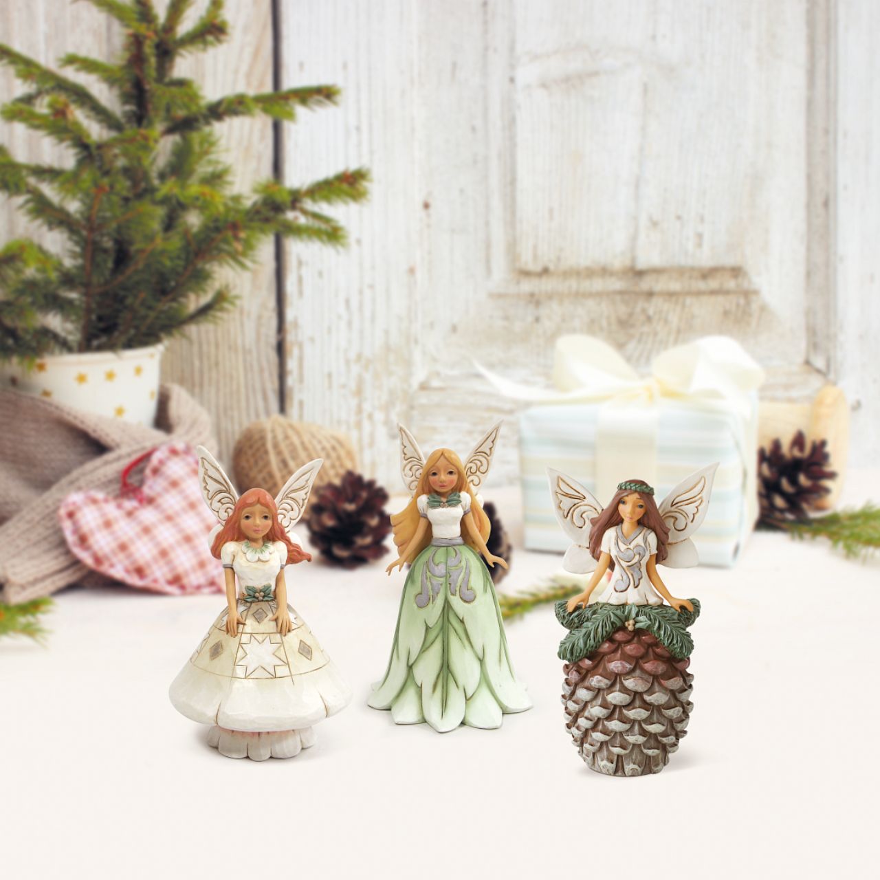 Fairy with Pinecone Skirt Figurine by Jim Shore  Always believe and if not then at the very least enjoy the whimsical beauty of fairy's. This new collection of whimsical woodland fairies brings some magic to the White Woodland Collection and is sure to be a collectors favourite.