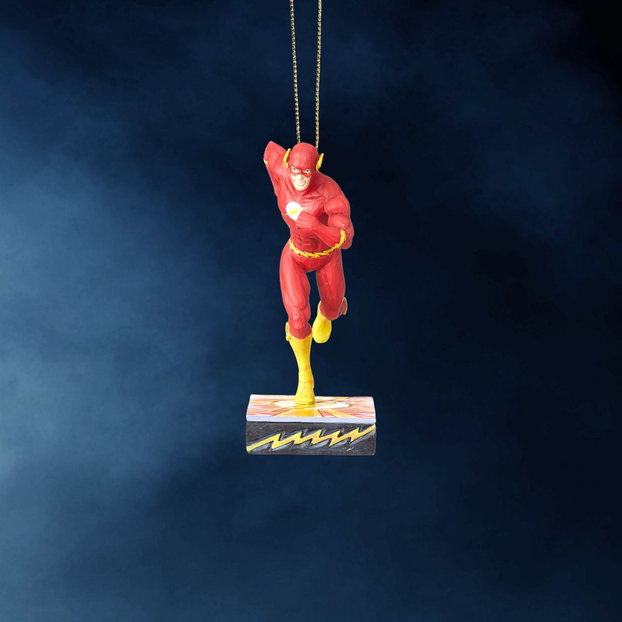 Jim Shore Flash Silver Age Christmas Hanging Ornament  DC Comics’ Justice League is comprised of the world’s most iconic superheroes. Jim Shore celebrates The Flash in an iconic pose in his signature wood carved look and folk art styling. Sure to be a treasured gift across the generations.